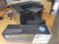 Tiskalnik Hp Laserjet P1606dn skupaj z original tonerjem