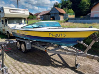 Gliser fletcher z motorjem in prikolico