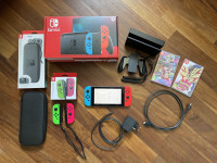 Nintendo Switch model 2019 + 2 kontrolerja + ovitek + igre