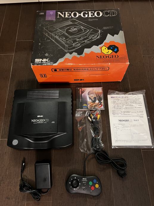 Konzola Neo Geo CD, 220V napajalnik, EUR regija, škatla, papirji....