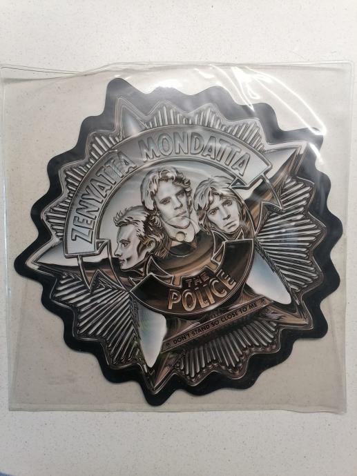 The police Zenyatta mondatta badge disc